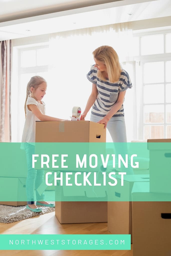 A woman and a little girl are packing boxes in a living room.